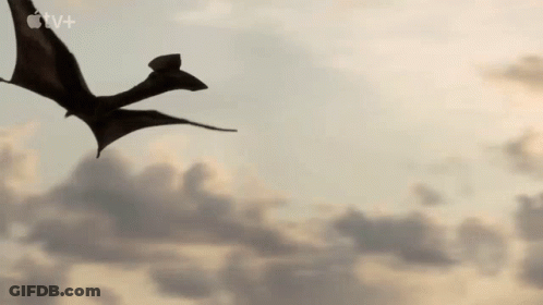 Silhouette Of Dragon Flying Through Sky GIF