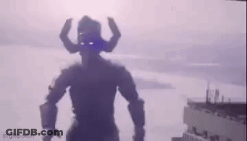 Silhouette Of Giant Robot With Horns In Front Of Building GIF