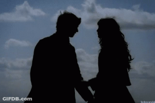Silhouette Of Man And Woman Kissing GIF