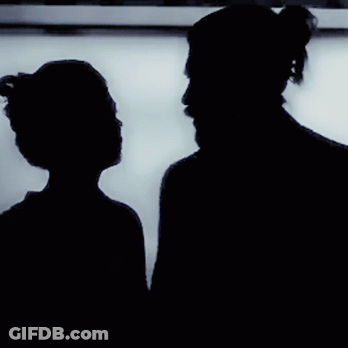 Silhouette Of Man And Woman Kissing GIF