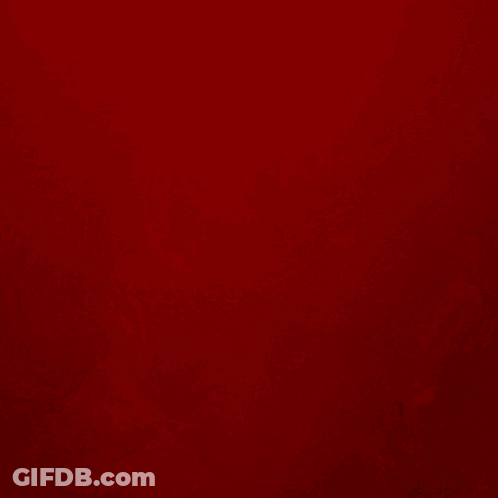 Silhouette Of Man Holding Bow And Arrow On Red Background GIF
