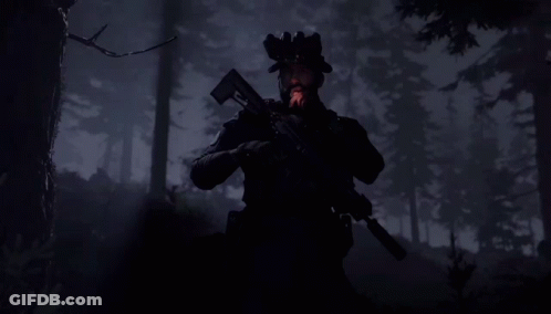 Silhouette Of Man Holding Gun In Forest GIF
