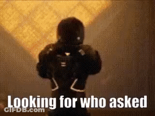 Silhouette Of Man Holding Gun Saying Looking For Who Asked GIF