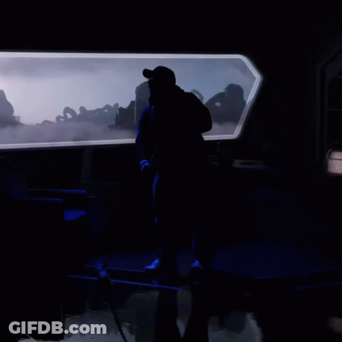 Silhouette Of Man In Dark Room GIF