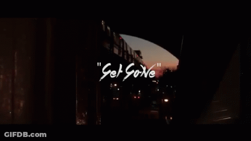 Silhouette Of Man In Dark Room With Neon Lights GIF