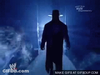 Silhouette Of Man In Hat Walking Down Hallway GIF