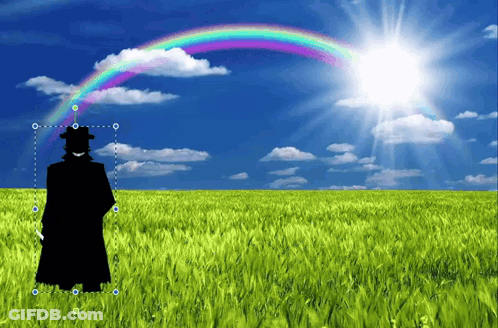 Silhouette Of Man Standing In Field With Rainbow GIF