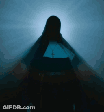Silhouette Of Nun With Cross Necklace GIF