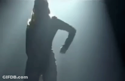 Silhouette Of Woman Dancing In Dark Room With Light GIF