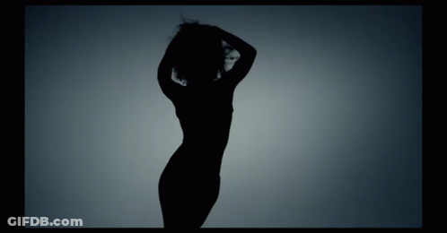 Silhouette Of Woman Dancing With Hands On Head GIF