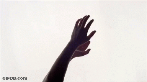 Silhouette Of Woman With Hands In Air GIF