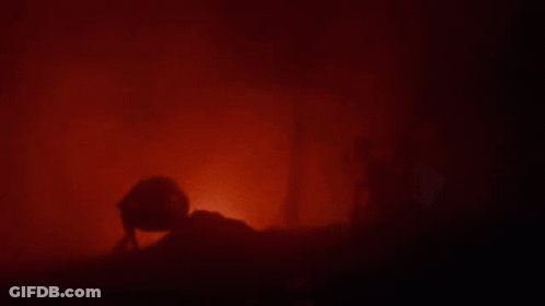 Silhouette Person In Dark Room With Red Light GIF