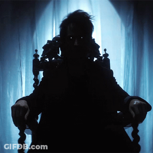 Silhouette Person Sitting In Chair By Window GIF