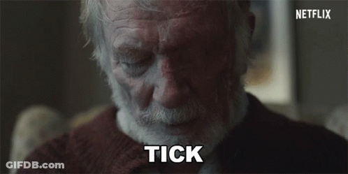 Silhouette Sitting In Chair Behind Glass Wall GIF