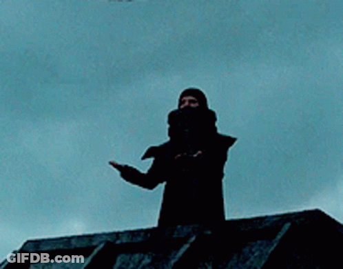 Silhouette Standing On Roof With Blue Sky GIF