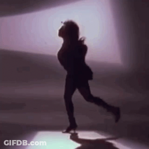 Silhouette Woman Dancing In Dark Room GIF