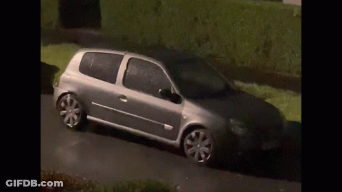 Silver Car Driving On Road With Hedge GIF