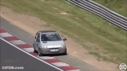 Silver Car With License Plate FSL NB8 On Race Track GIF