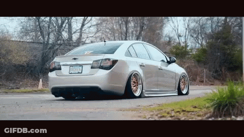 Silver Car With New Jersey License Plate Driving Down Road GIF