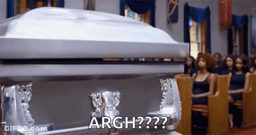 Silver Coffin In Church With Women GIF