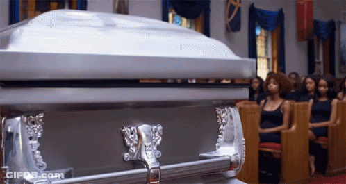 Silver Coffin In Church With Women In Pews GIF