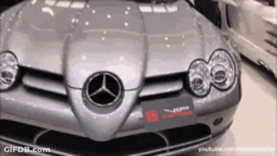 Silver Gray Mclaren Supercar On Display GIF