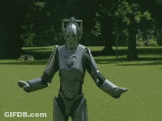 Silver Robot Standing In Field GIF