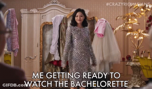 Silver Sequined Woman Getting Ready To Watch Bachelorette GIF