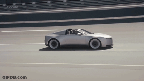 Silver Sports Car Driving Down Highway With Youcar Sign GIF