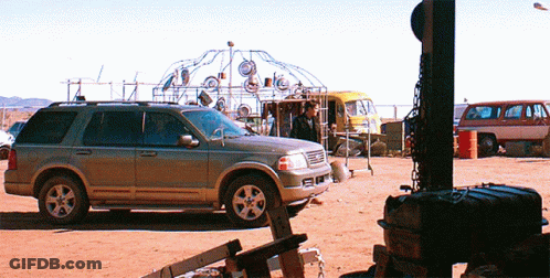 Silver SUV Parked In Dirt Field GIF