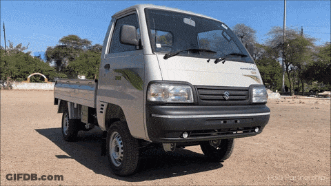 Silver Suzuki Truck Parked In Dirt GIF