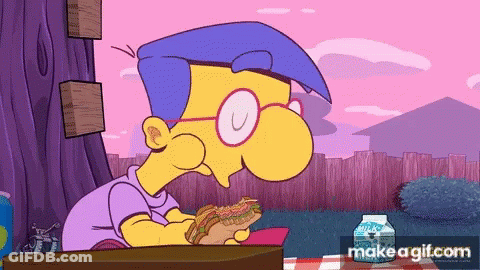 Simpsons Character At Desk With Notebook In Front Of Group GIF