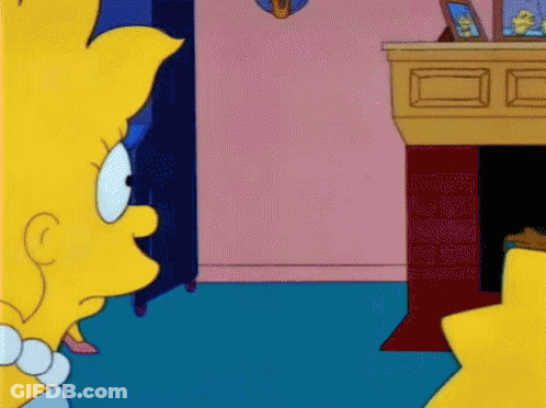 Simpsons Character Sitting By Fireplace GIF
