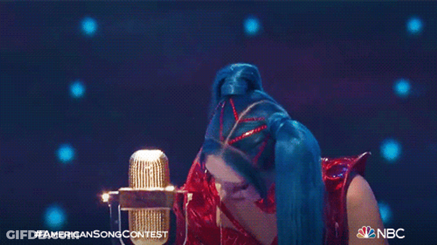 Singer Raising A Trophy GIF