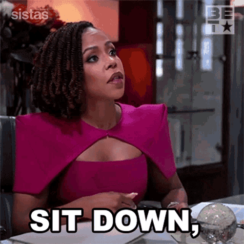 Sit Down Now Andrea Barnes GIF