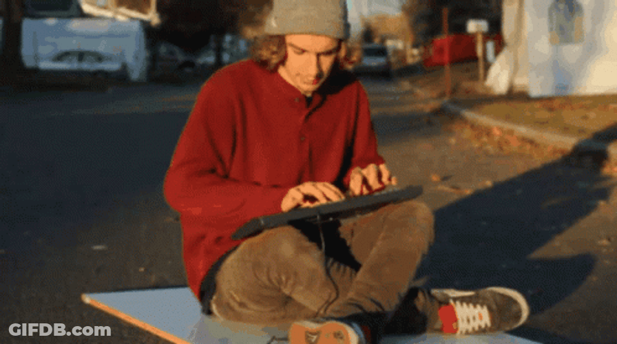 Sitting Man Doing Fast Typing GIF