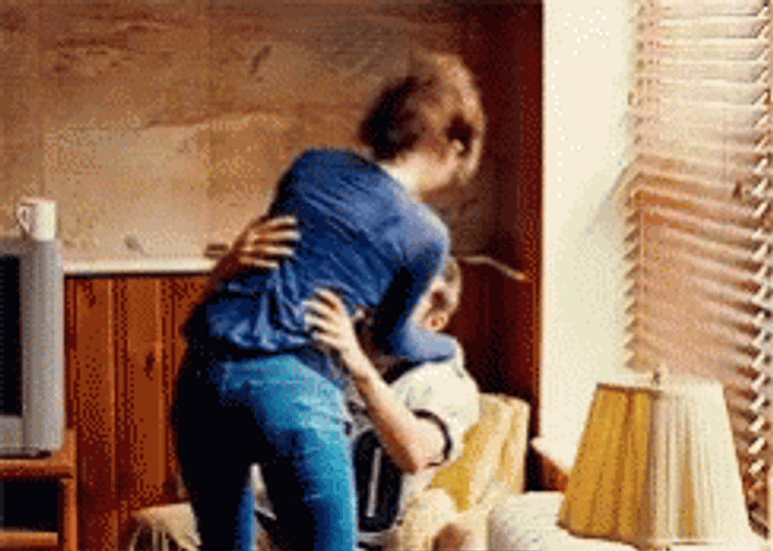 Sitting On Lap Hugs And Kisses GIF
