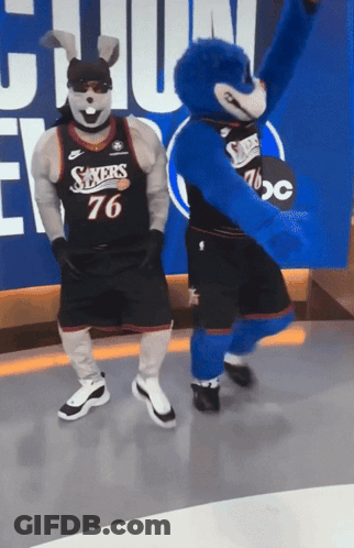 Sixers Mascots Dancing In Front Of ABC Sign GIF