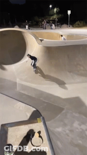 Skateboarder Doing Trick At Night GIF