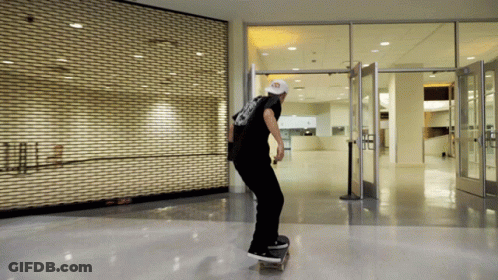 Skateboarder Doing Trick In Front Of Closed Store GIF