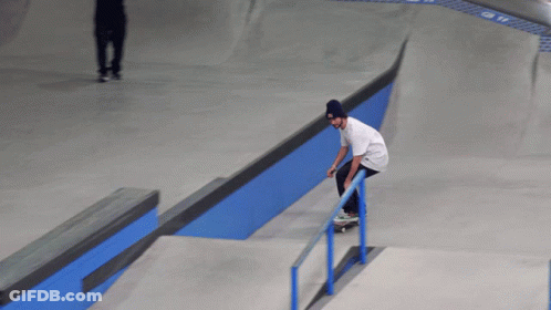 Skateboarder Doing Trick On Blue Railing GIF