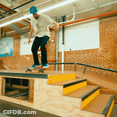 Skateboarder Doing Trick On Ramp With Summit GIF