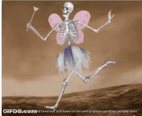 Skeleton Dressed As Fairy Holding Wand And Flower GIF