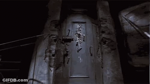 Skeleton Hanging On Door GIF