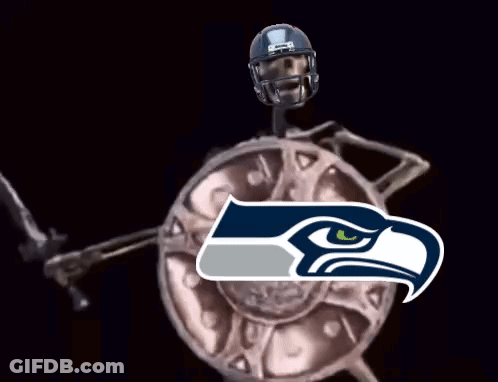 Skeleton In Seahawks Helmet Holding Sword And Shield GIF