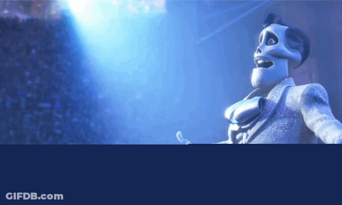Skeleton In Suit Standing Before Crowd GIF