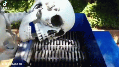Skeleton Laying On Shredder With Skull In Mouth GIF