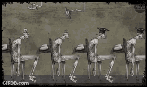 Skeleton Sitting At Table With Books GIF