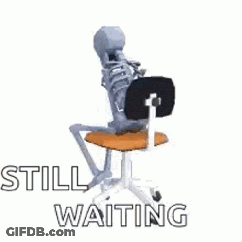Skeleton Sitting On Chair Saying Still Waiting GIF