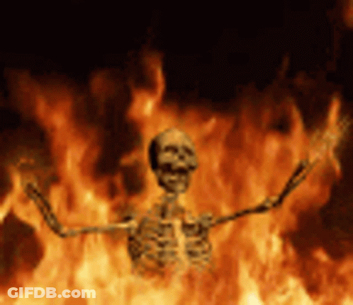 Skeleton Standing In Fire With Outstretched Arms GIF